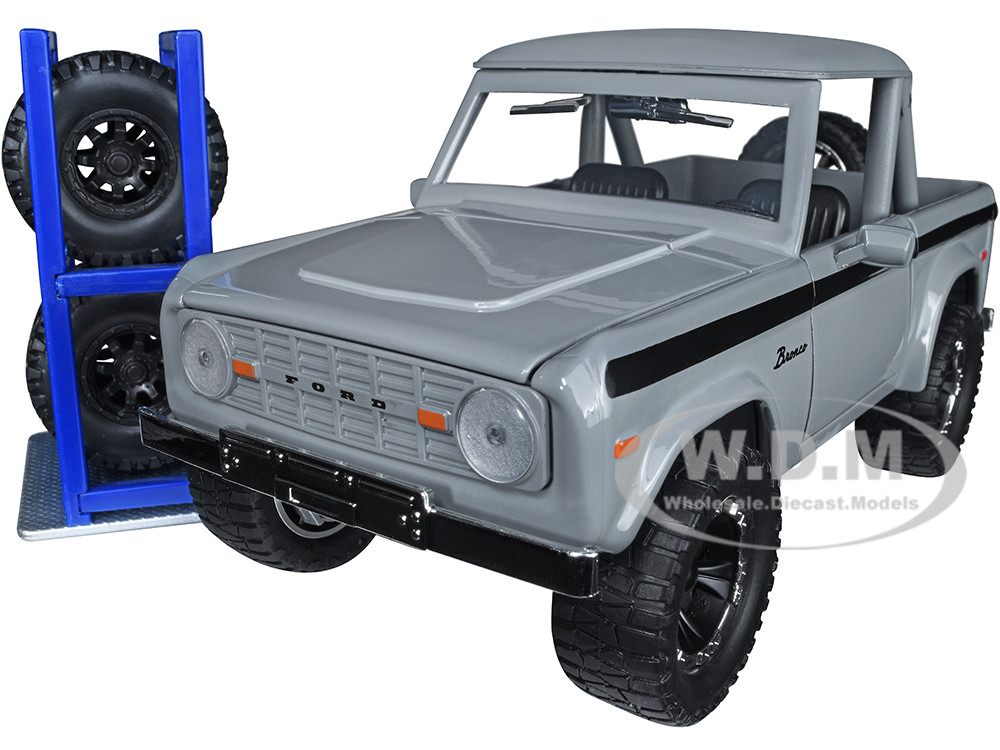1973 Ford Bronco Pickup Truck Gray with Black Stripes with Extra Wheels "Just Trucks" Series 1/24 Diecast Model Car by Jada diecast model