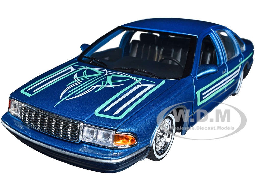 1993 Chevrolet Caprice Lowrider Blue Metallic with Graphics "Get Low" Series 1/24 Diecast Model Car by Motormax diecast model
