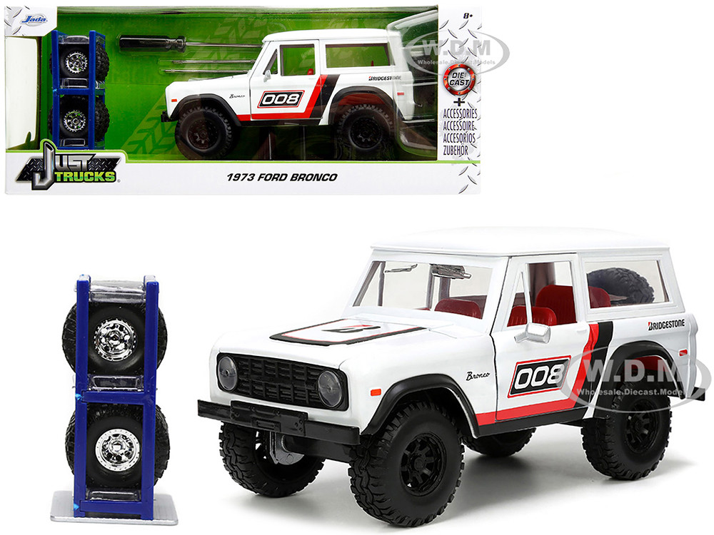 1973 Ford Bronco #008 White with Red and Black Stripes and Red Interior with Extra Wheels "Just Trucks" Series 1/24 Diecast Model Car by Jada diecast model