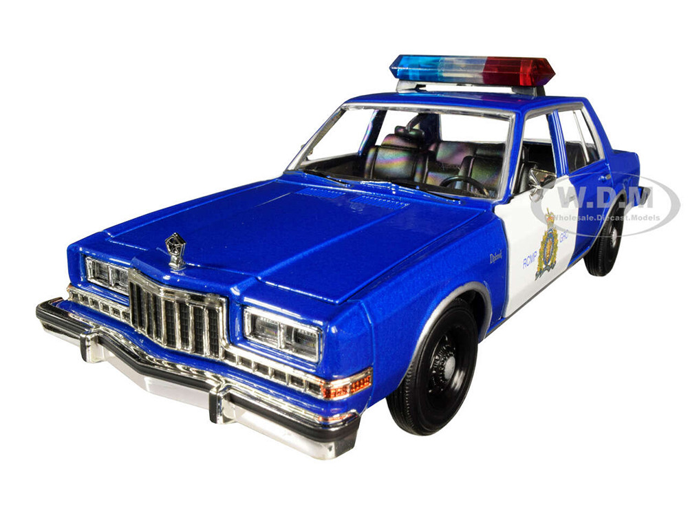 1986 Dodge Diplomat "Royal Canadian Mounted Police" Metallic Blue and White 1/24 Diecast Model Car by Motormax diecast model