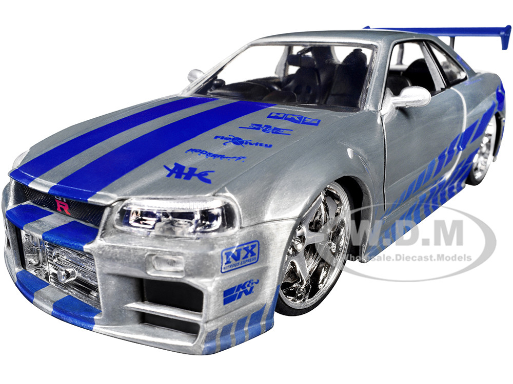 Brian's Nissan Skyline GT-R (R34) RHD (Right Hand Drive) Silver Color Brush Finish with Blue Stripes "2 Fast 2 Furious" (2003) Movie "Fast & Furious" Series 1/24 Diecast Model Car by Jada diecast model