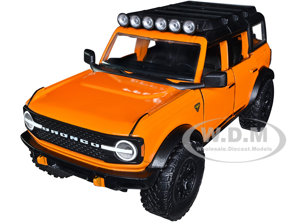 2021 Ford Bronco Orange with Black Stripes and Roof Rack "Just Trucks" Series 1/24 Diecast Model Car by Jada diecast model