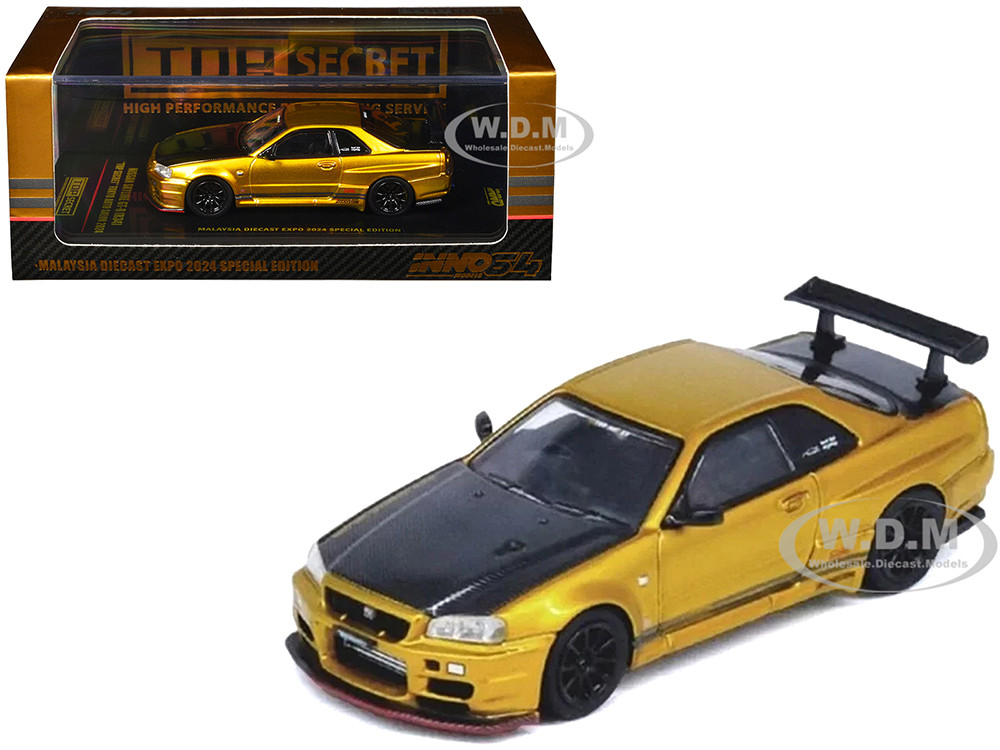 Nissan Skyline GT-R (R34) "Top Secret" RHD (Right Hand Drive) Gold Metallic with Carbon Hood and Trunk "Tokyo Auto Salon 2024 - Malaysia Diecast Expo 2024" 1/64 Diecast Model Car by Inno Models diecast model