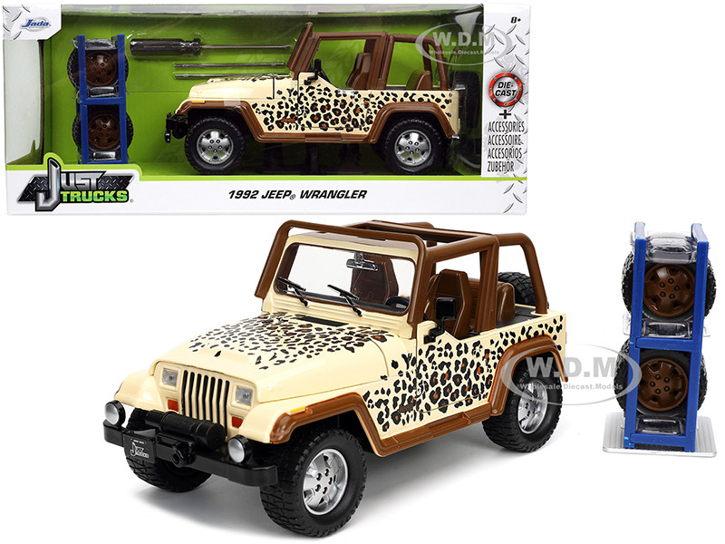 1992 Jeep Wrangler Tan and Brown with Graphics and Extra Wheels "Just Trucks" Series 1/24 Diecast Model Car by Jada diecast model
