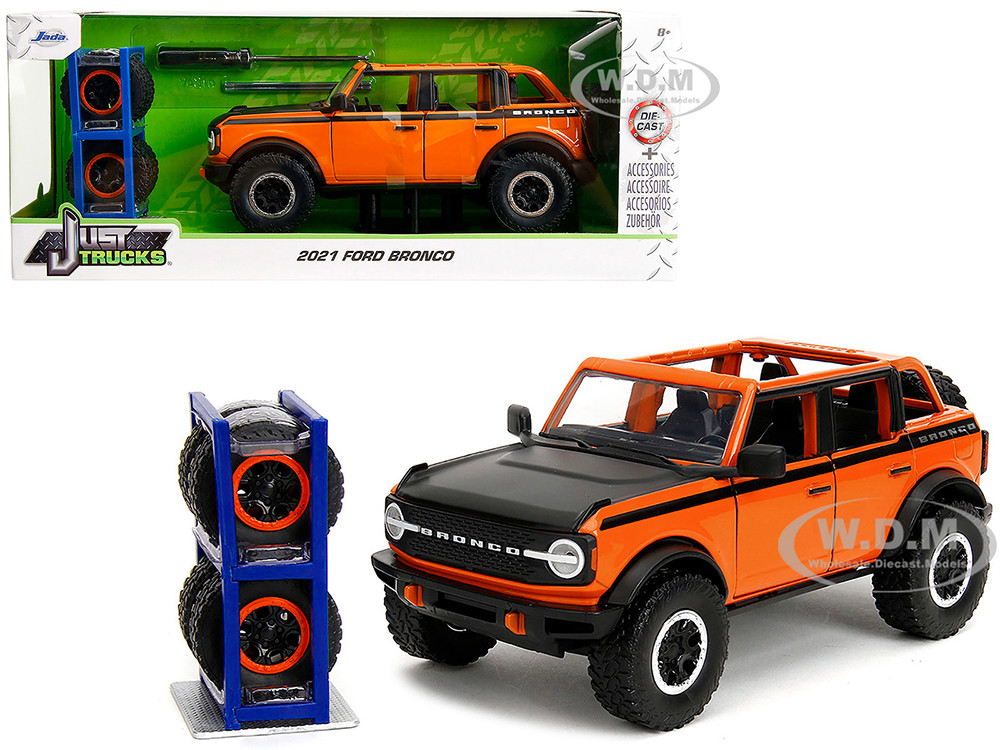 2021 Ford Bronco Open-Top Orange with Black Stripes and Hood with Extra Wheels "Just Trucks" Series 1/24 Diecast Model Car by Jada diecast model