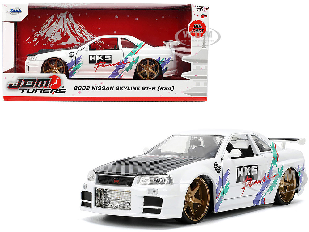 2002 Nissan Skyline GT-R (R34) RHD (Right Hand Drive) "HKS Power" White with Carbon Hood and Graphics "JDM Tuners" Series 1/24 Diecast Model Car by Jada diecast model
